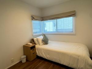 Ένα ή περισσότερα κρεβάτια σε δωμάτιο στο Akikawa Mashiki 3