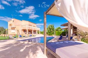 an image of a villa with a swimming pool at Villa Es Contes by Slow Villas in Santanyi