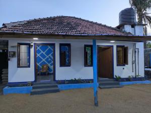 a small house with a blue and white at Manha Blue Villa Arugambay in Arugam Bay +15 photos