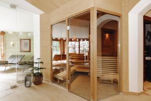 a room with a large glass door with a table at Appartements Gut Berg in Sankt Johann im Pongau