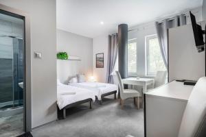 Giường trong phòng chung tại Hostel Gdynia - Pokoje 2-osobowe na wyłączność