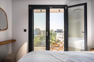 Giường trong phòng chung tại Koasis Boutique Apartments