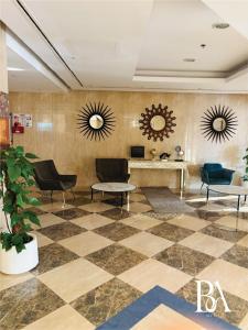 a lobby with chairs and mirrors on the wall at Bel Air -- Sea View Studio in Ras al Khaimah +44 photos