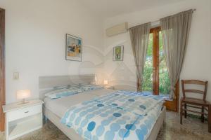 Postel nebo postele na pokoji v ubytování Casa Pavel a Colle di Lido - Goelba