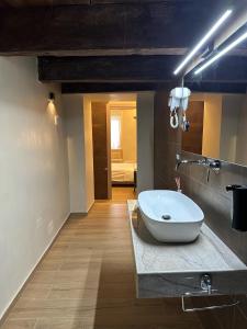 a bathroom with a large bowl sink on a counter at al Vico Bedrooms in Crotone