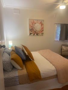 a bedroom with a bed with pillows at Birchmoore Studio in Penola