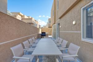 a long table and chairs on the side of a building at The Pender LUX HUB - 4BR villas with Pool, WIFI & AC by 360 Estates in St Julian's