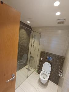 a bathroom with a toilet and a shower at Studio at Damak Jordan in Amman
