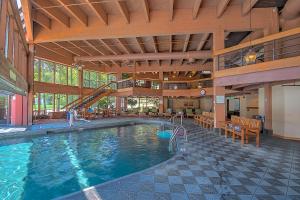 a large pool in a large building with a slide at 4429 Beaver Run Resort in Breckenridge