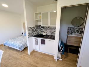 a small room with a kitchen and a bed at LE CHARME D OGNES in Ognes +46 photos