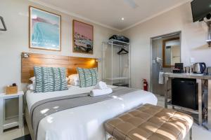 Postel nebo postele na pokoji v ubytování Camps Bay Village - Stone Cottages + 73 fotografií