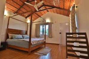 Postel nebo postele na pokoji v ubytování Gonakal Homestay