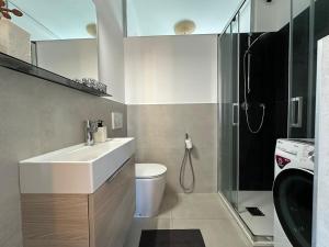 a bathroom with a sink and a shower at Venezia-Mestre Train Station Relax Suites in Venice
