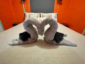 a pair of towel animals on a bed at The Shanty in American River