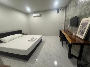 Postel nebo postele na pokoji v ubytování สวนย่า รีสอร์ท