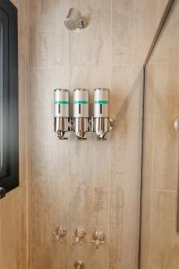 a bathroom with a chandelier on the wall at Hotel Lindor in Santiago del Estero