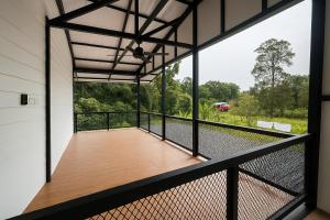 a view from the balcony of a house at Inap Keranji Homestay With Pool in Kota Bharu