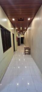 a hallway with a bench in a building at Hotel O Banaras Guest House in Banāras Cantonment