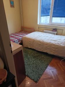 Ένα ή περισσότερα κρεβάτια σε δωμάτιο στο Nensy's apatments