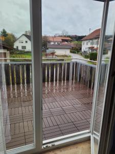 a view of a deck from a window at Ferienwohnung Lindenblüte in Eggenthal