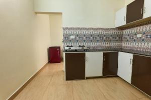 Η κουζίνα ή μικρή κουζίνα στο Immanuel Homestay, Kalathipady, Kottayam, Flat B +6 φωτογραφίες