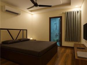 Ένα ή περισσότερα κρεβάτια σε δωμάτιο στο STAY ROTAL VILLA BNB 1st F