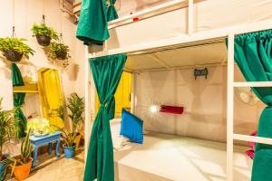 a room with a bunk bed and plants at goSTOPS Lite Jaipur in Jaipur +57 photos