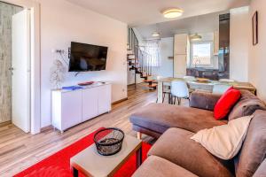 Et tv og/eller underholdning på Apartments Medna