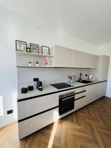 Kuchyň nebo kuchyňský kout v ubytování Appartamento Essenza