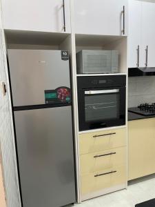 Η κουζίνα ή μικρή κουζίνα στο Travelton Homes