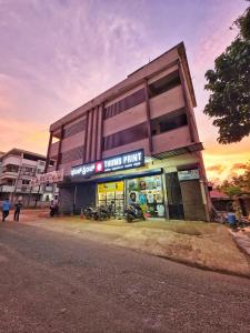 a building with a store with motorcycles in front of it at The Urban Escape in Udupi