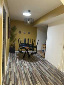 a dining room with a table and chairs at Appartement Peronne Centre in Péronne