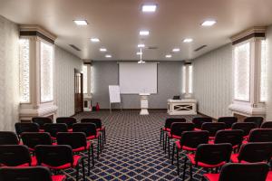 a conference room with chairs and a white screen at Alis Business Hotel baku in Baku +71 photos