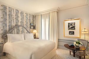 a hotel room with a bed and a window at Hôtel Métropole Monte-Carlo - Spa Guerlain in Monte Carlo