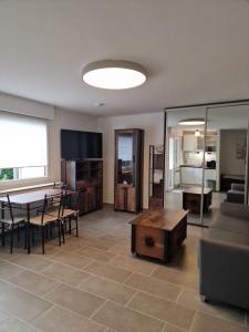 a living room with a table and a dining room at Linda's Appartement in Bochum