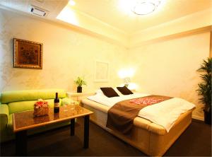 Postel nebo postele na pokoji v ubytování ホテル 白雪姫 -水島インターチェンジ隣-