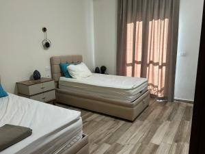 Postel nebo postele na pokoji v ubytování New Alamein-Latini District