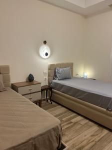 Postel nebo postele na pokoji v ubytování New Alamein-Latini District