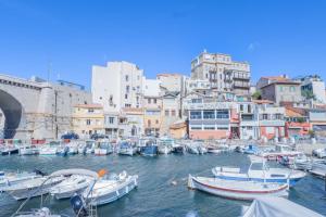 a bunch of boats are docked in a harbor at Le Cabanon du Vallon - Port des Auffes - Clim in Marseille