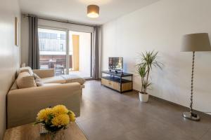 TV a/nebo společenská místnost v ubytování La Terrasse de Duranne