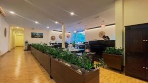 TV a/nebo společenská místnost v ubytování Indochine Sanctuary Boutique Hotel + 91 fotografií