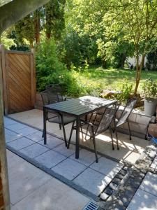 a table and chairs sitting on a patio at Ferienwohnung Landhaus Scholz in Bad Münder am Deister
