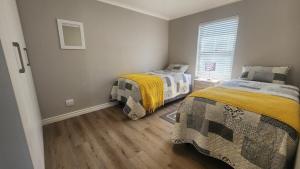 Ένα ή περισσότερα κρεβάτια σε δωμάτιο στο Sandyfeet