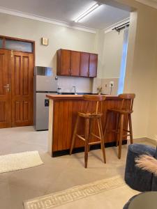 Η κουζίνα ή μικρή κουζίνα στο Travelton Homes