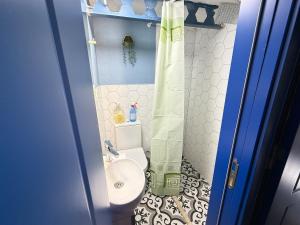 a small bathroom with a toilet and a sink at Loft Cosy Stone House in Konak +24 photos