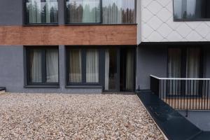 a building with a ramp in front of it at Apartment Nuve in Bjelašnica