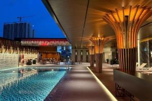 a hotel with a swimming pool and a building at Vivatel Kuala Lumpur in Kuala Lumpur