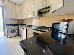 Kuchyň nebo kuchyňský kout v ubytování Lux bay