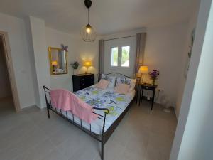 a bedroom with a bed and a window at House Piloda in Néa Thésis +7 photos