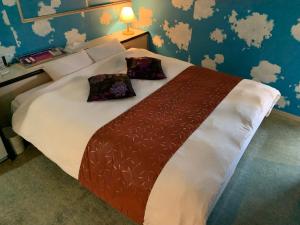 Postel nebo postele na pokoji v ubytování JOY GARDEN